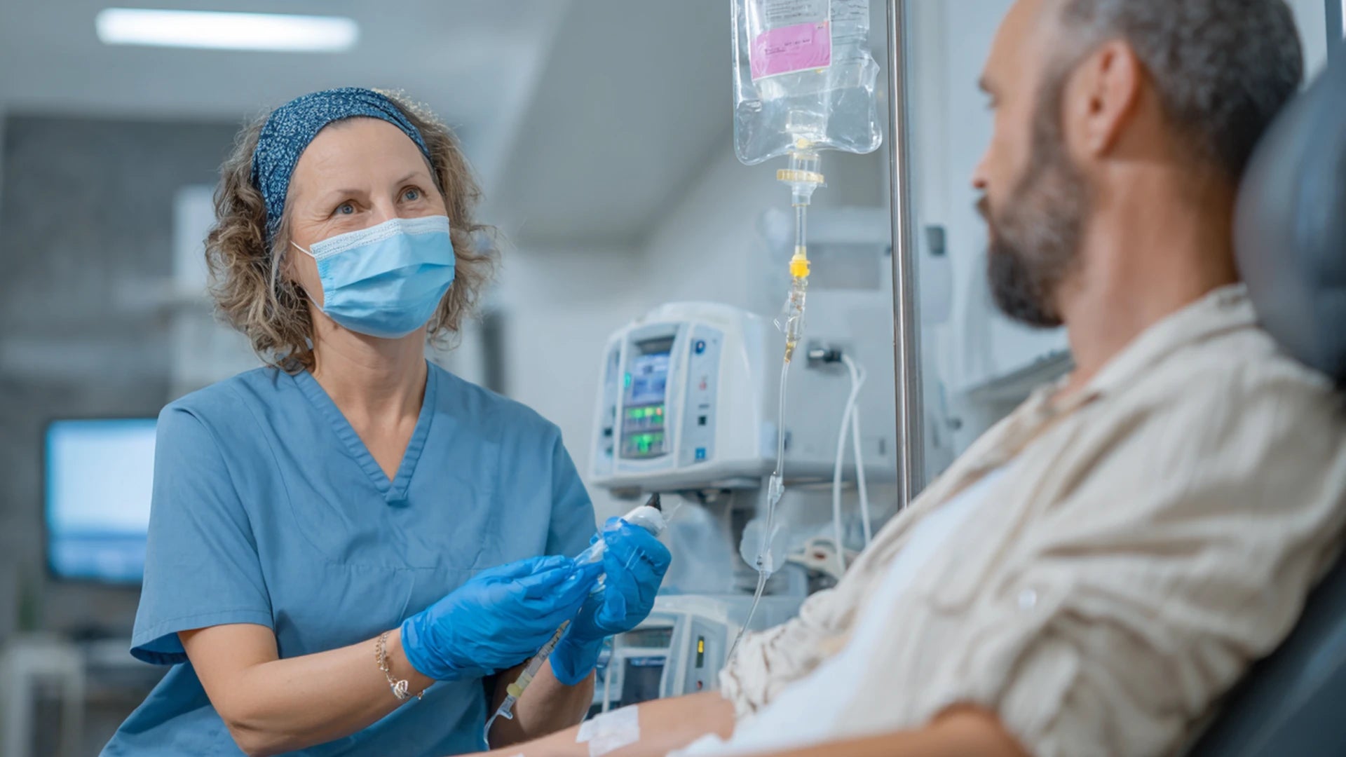 Medical professional setting up NAD+ IV infusion under sterile conditions.