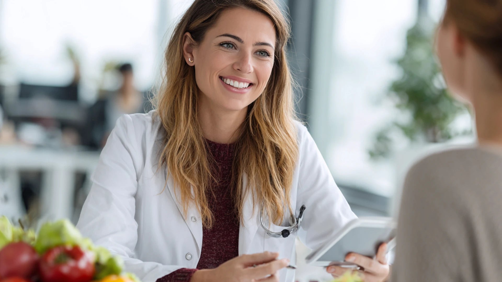 Dietitian guiding patient on protein and meal planning after GLP-1 therapy.