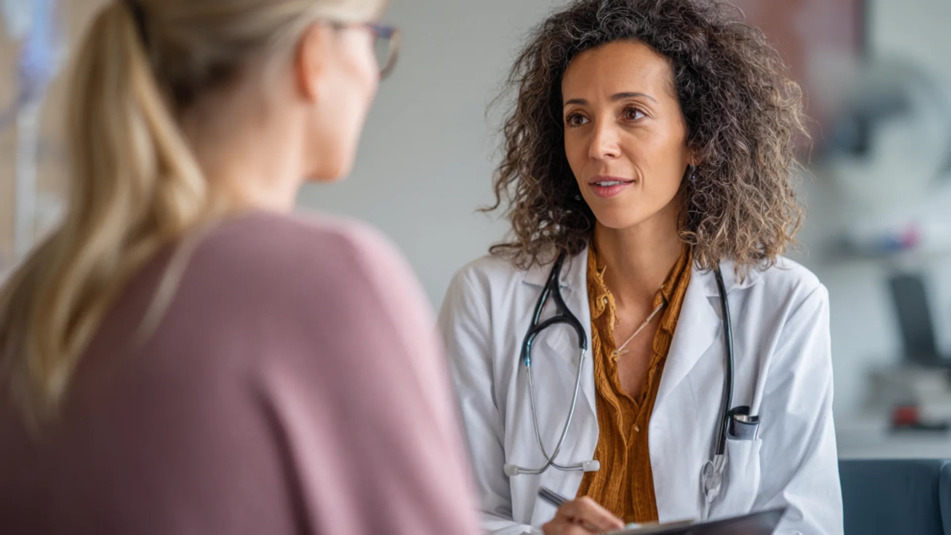 Physician discussing tirzepatide vs semaglutide treatment choices.