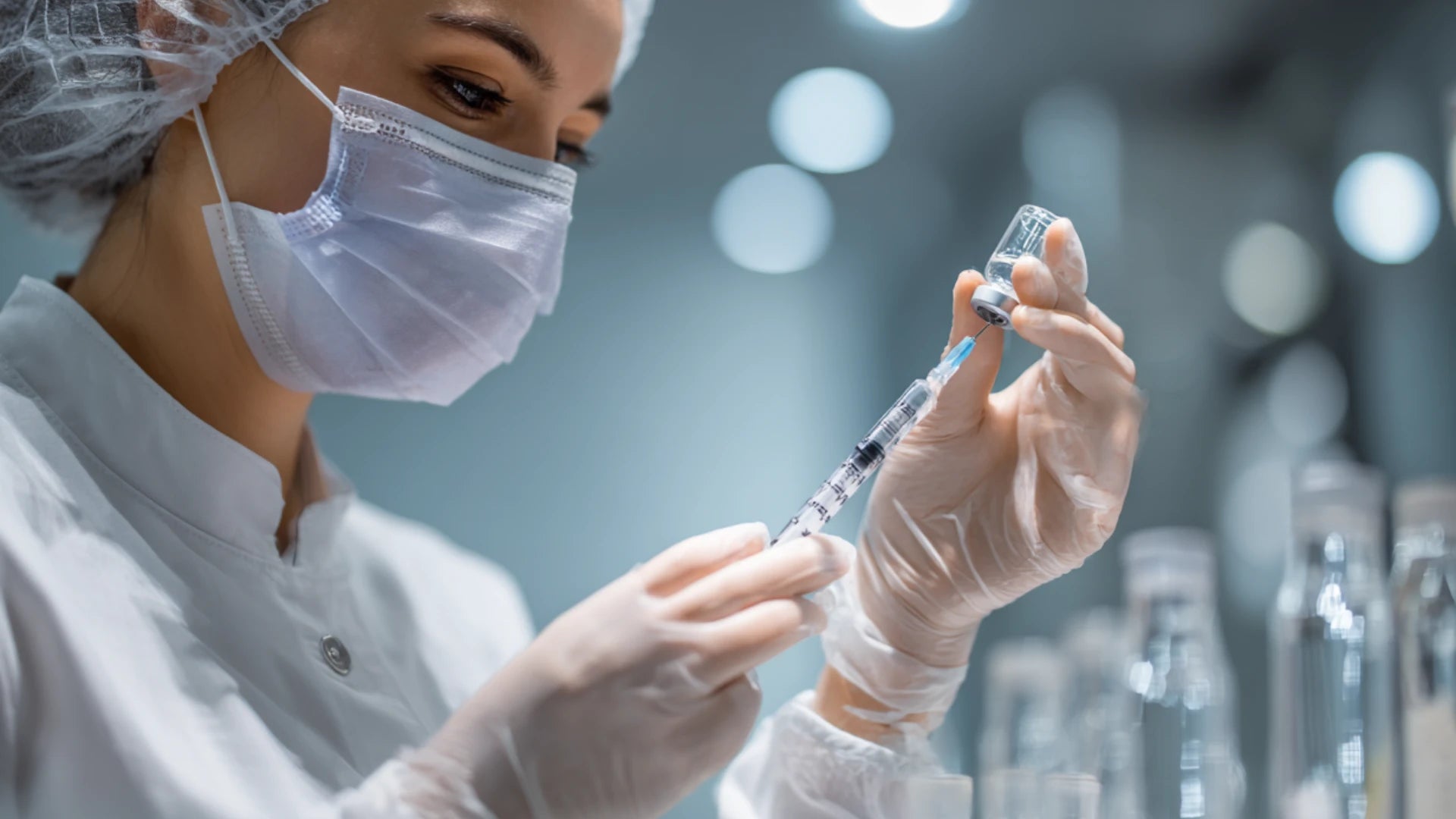 Medical professional preparing peptide injection for patient therapy.